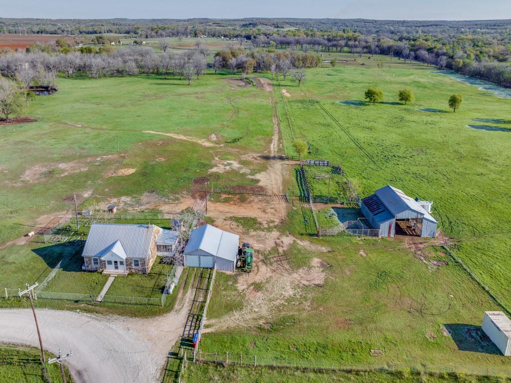 3061 Turkey Creek Road Sunset, TX 76270 - Photo 25 of 31 an aerial view of residential houses with outdoor space and city view