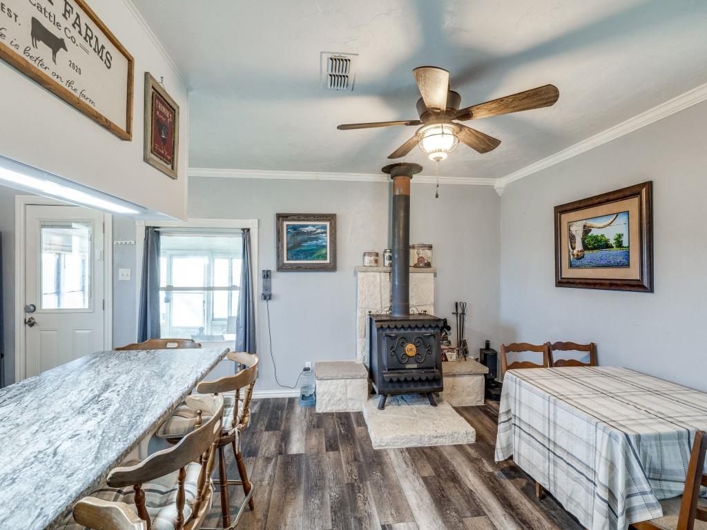 3061 Turkey Creek Road Sunset, TX 76270 - Photo 7 of 31 a bedroom with furniture and a chandelier