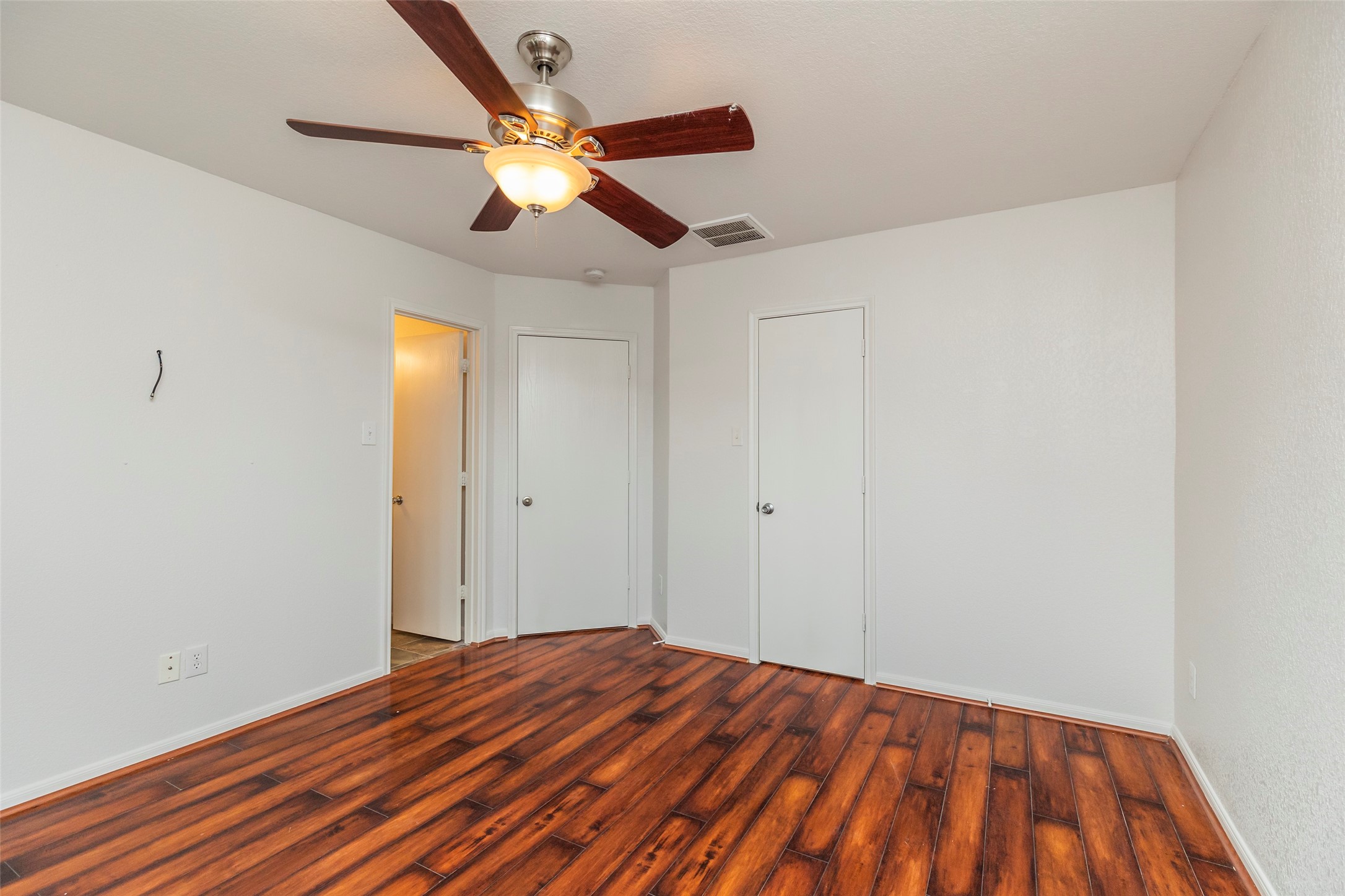 21202 Fire Wind Court Spring, TX 77379 - Photo 11 of 21 Primary Bedroom. Spacious and serene main bedroom perfect for rest and relaxation.