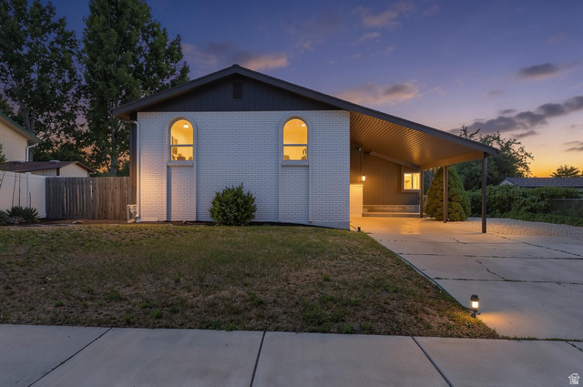 432 Calnette Drive Sandy, UT 84070 - Photo 1 of 48 Contemporary residence featuring a white brick facade and a dark-toned roof