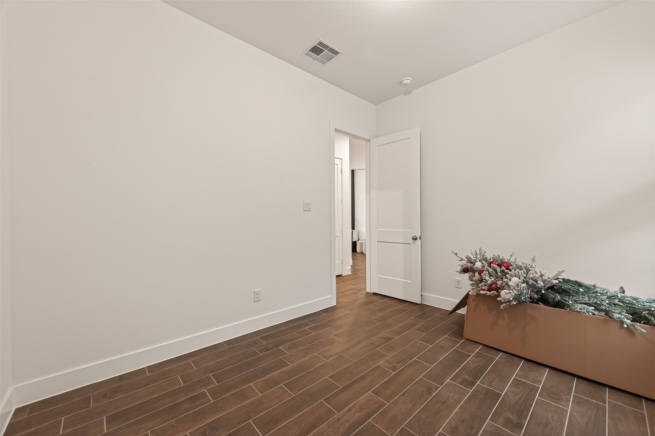 5019 Country Mdws Trail Rosharon, TX 77583 - Photo 29 of 49 a view of a room with wooden floor