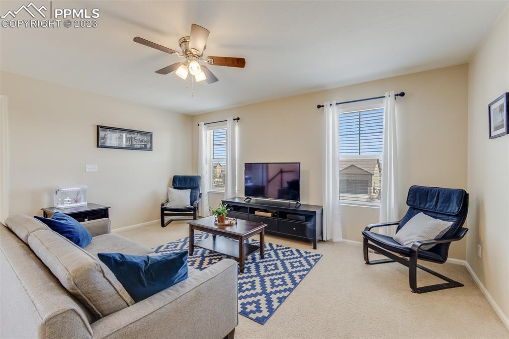 7122 Golden Acacia Lane Colorado Springs, CO 80927 - Photo 14 of 37 a living room with furniture and a window
