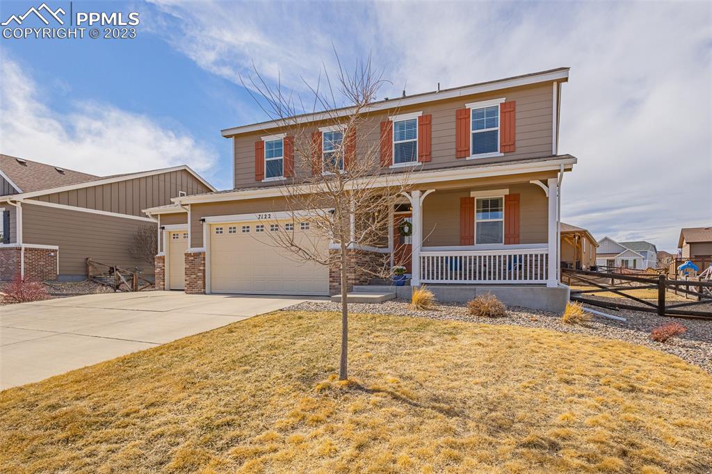 7122 Golden Acacia Lane Colorado Springs, CO 80927 - Photo 2 of 37 a house view with a outdoor space