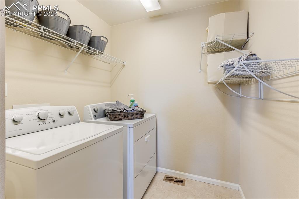 7122 Golden Acacia Lane Colorado Springs, CO 80927 - Photo 22 of 37 a utility room with dryer and washer