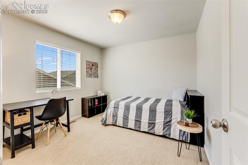 7122 Golden Acacia Lane Colorado Springs, CO 80927 - Photo 23 of 37 a living room with furniture and a window