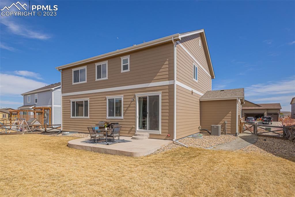 7122 Golden Acacia Lane Colorado Springs, CO 80927 - Photo 29 of 37 a view of a house with a patio