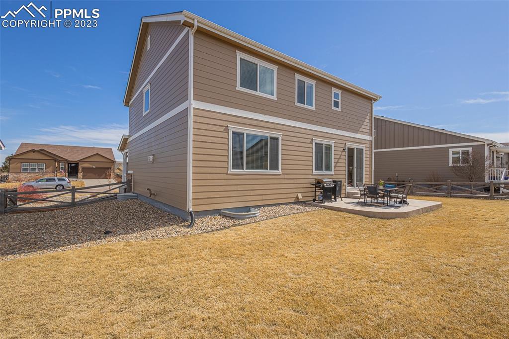 7122 Golden Acacia Lane Colorado Springs, CO 80927 - Photo 30 of 37 a view of a house with swimming pool and a car parked on road