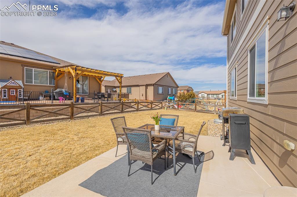 7122 Golden Acacia Lane Colorado Springs, CO 80927 - Photo 31 of 37 a view of a swimming pool with outdoor seating