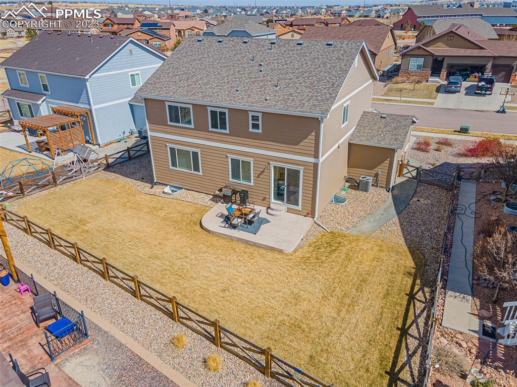 7122 Golden Acacia Lane Colorado Springs, CO 80927 - Photo 34 of 37 a view of a house with tub and chairs