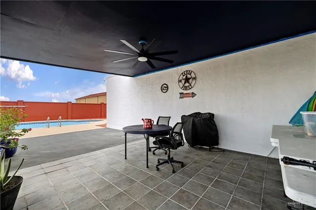a view of a house with a yard and furniture