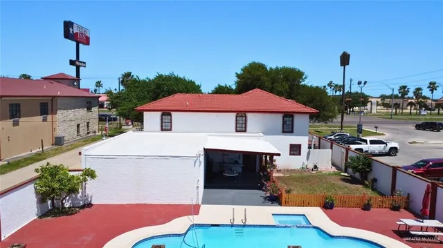a view of swimming pool with seating space