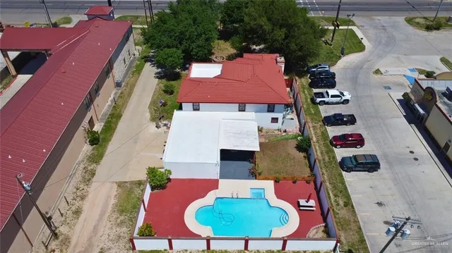 an aerial view of a houses with yard