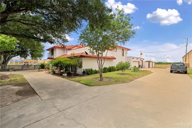 a view of a street with houses on both side of the street