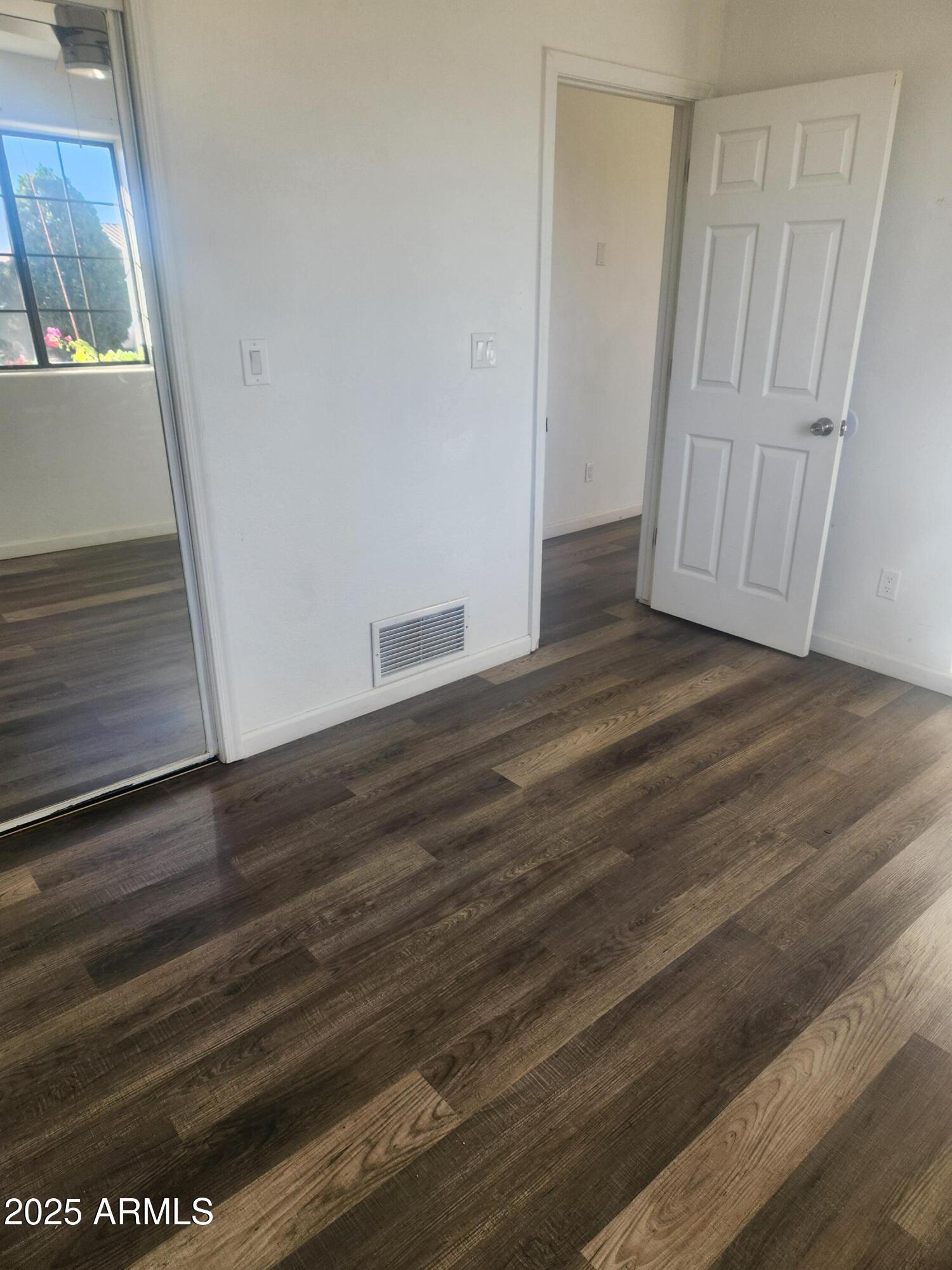1940 East 13th Street Douglas, AZ 85607 - Photo 12 of 32 a view of empty room with wooden floor