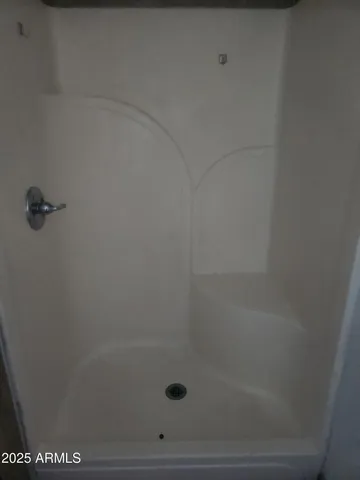 a white toilet sitting next to a white sink