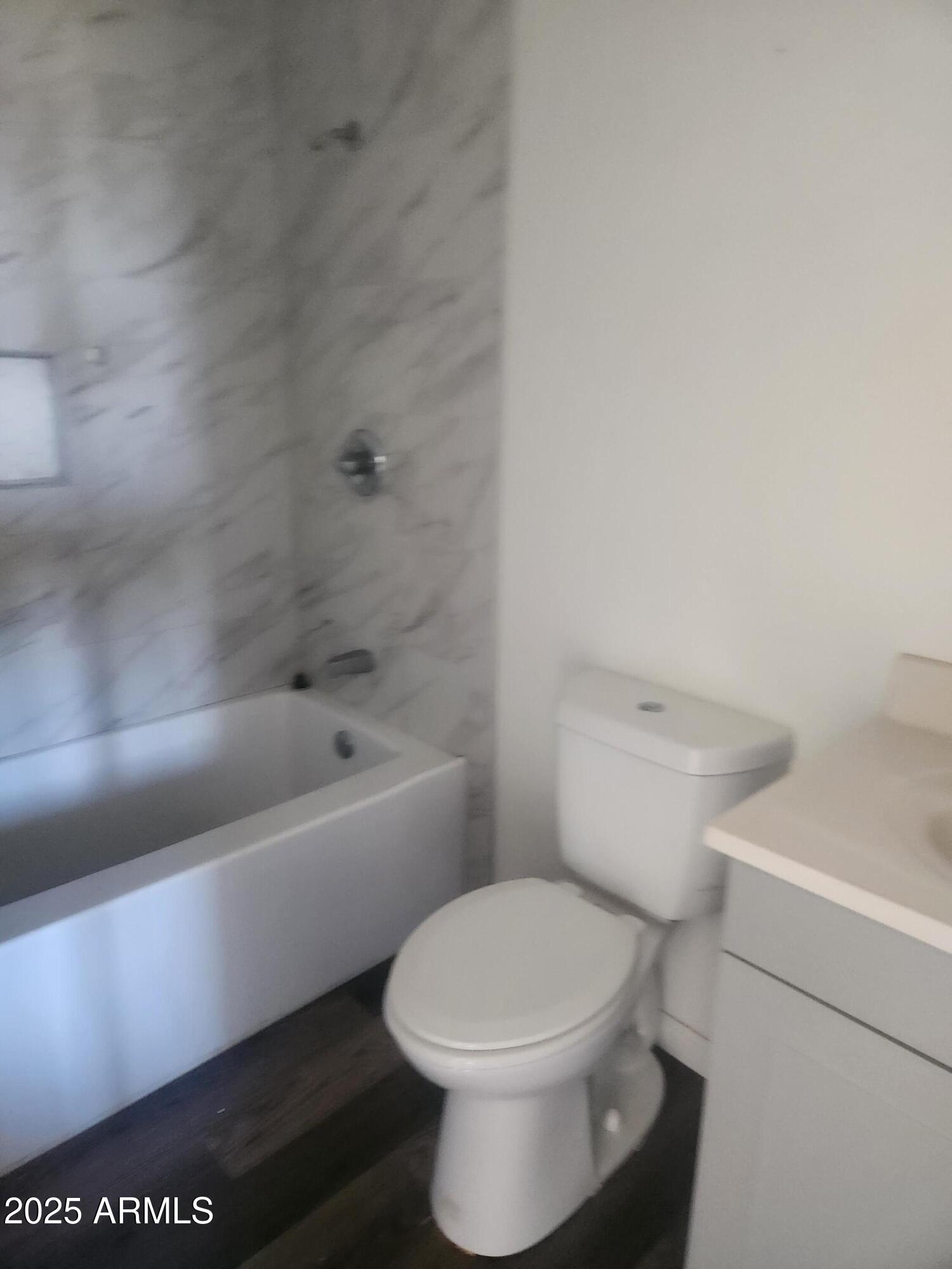 1940 East 13th Street Douglas, AZ 85607 - Photo 19 of 32 a white toilet sitting next to a bathtub