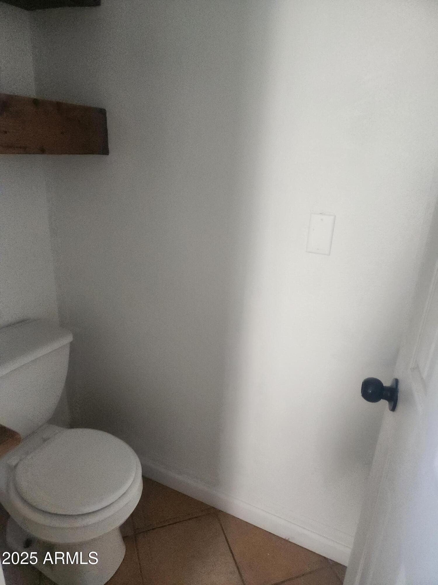 1940 East 13th Street Douglas, AZ 85607 - Photo 24 of 32 a white toilet sitting next to a white wall