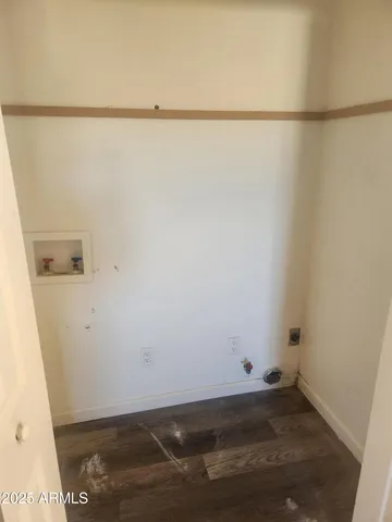 a view of small space with empty racks on the wall