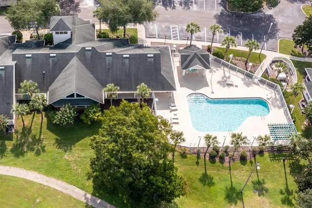 an outdoor space with seating area and green space