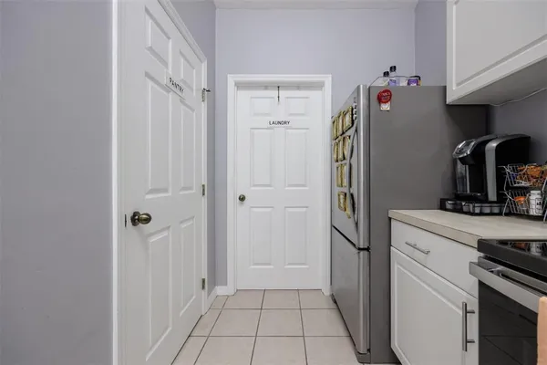 a kitchen with stainless steel appliances granite countertop a sink a stove top oven a counter space and cabinets