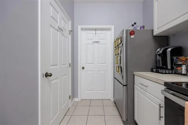 a kitchen with stainless steel appliances granite countertop a sink a stove top oven a counter space and cabinets