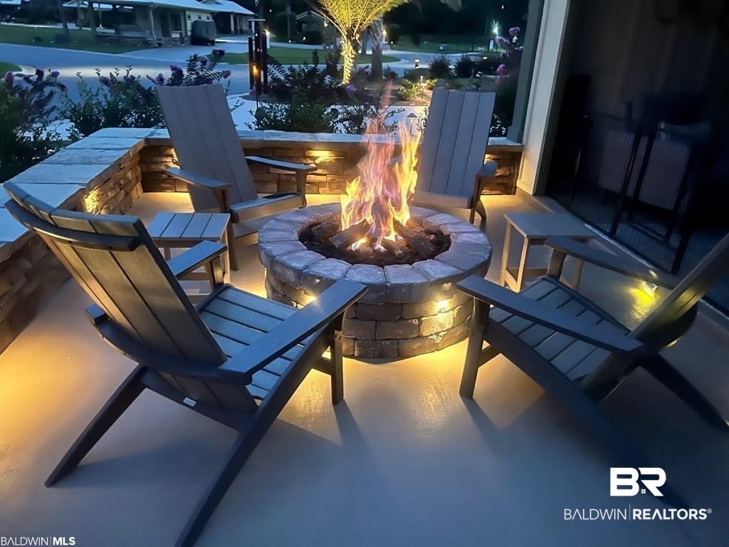 496 Portofino Loop Foley, AL 36535 - Photo 29 of 54 View of patio / terrace with a fire pit