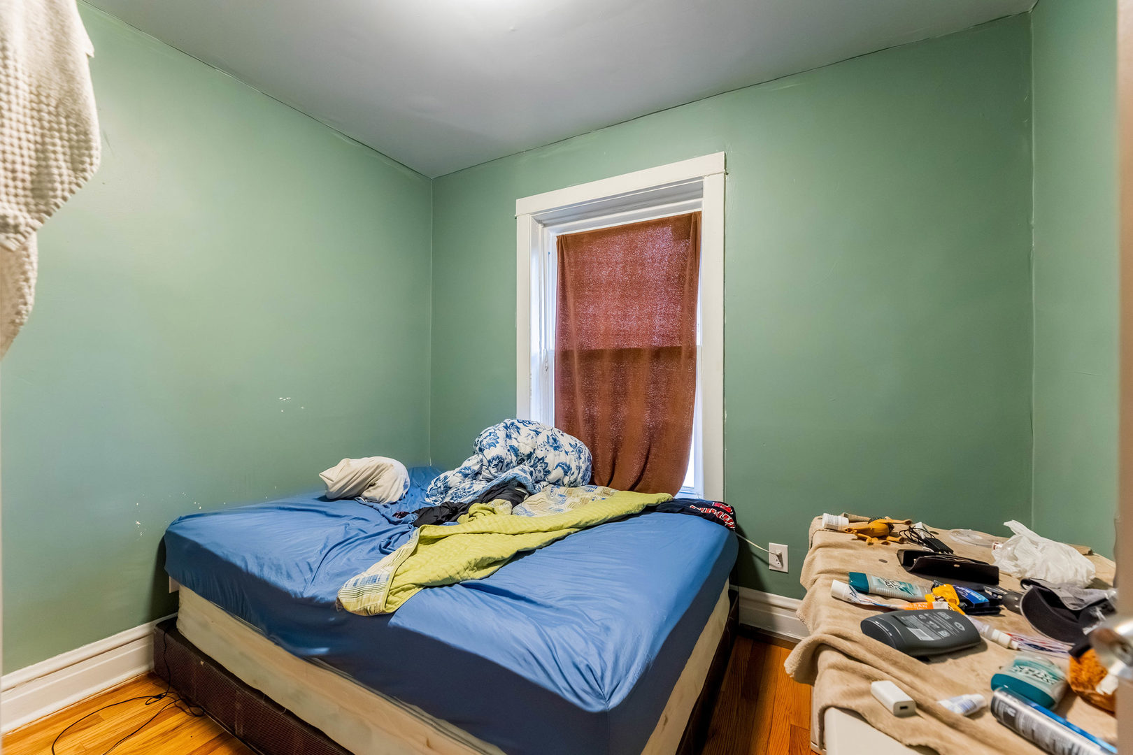 4747 West Monroe Street Chicago, IL 60644 - Photo 11 of 31 a bedroom with a bed and wooden floor