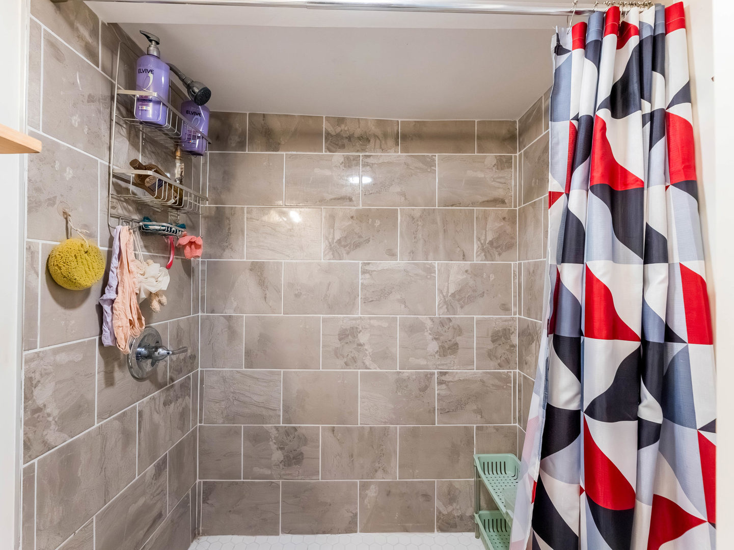 4747 West Monroe Street Chicago, IL 60644 - Photo 23 of 31 a bathroom with a bathtub and a shower