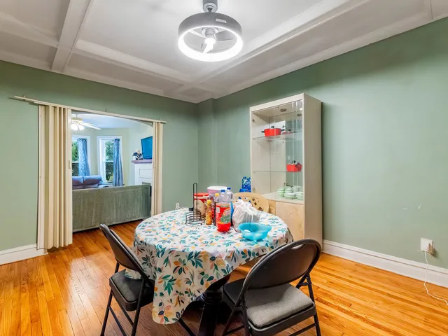a dining room with furniture and window
