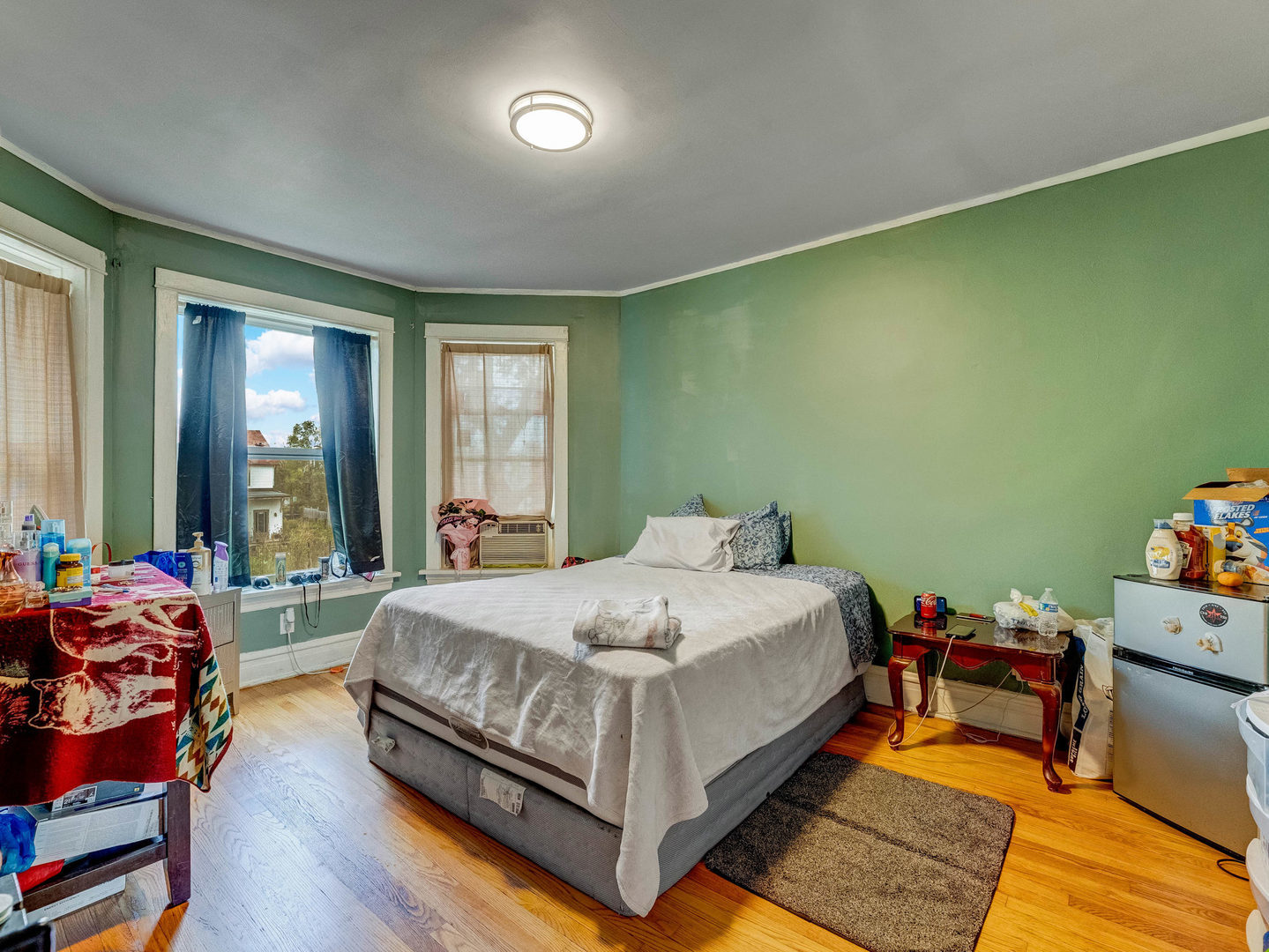 4747 West Monroe Street Chicago, IL 60644 - Photo 9 of 31 a bedroom with a bed and wooden floor