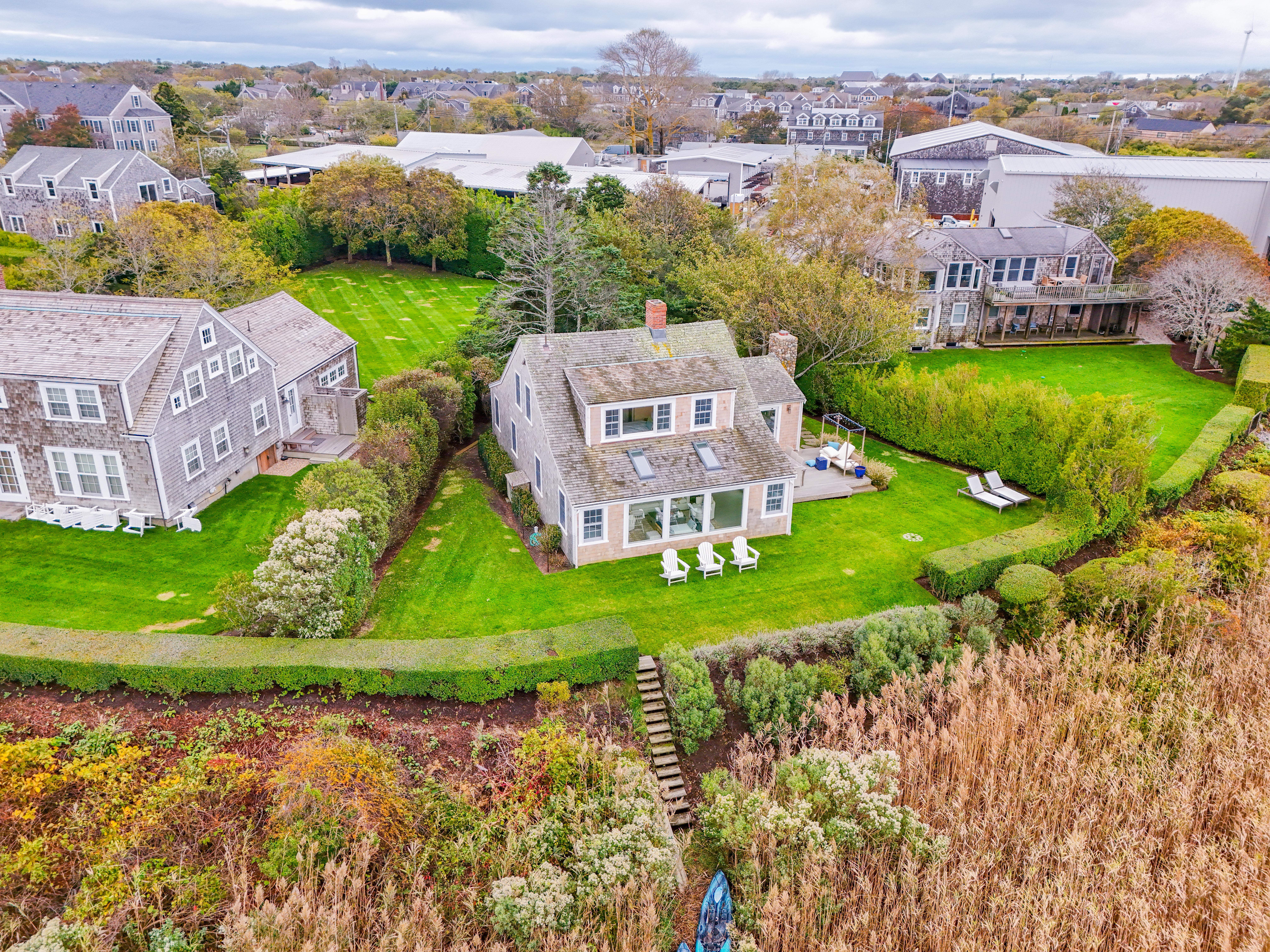 6 Harbor Terrace Nantucket, MA 02554 - Photo 2 of 18 an aerial view of a house with a garden and lake view