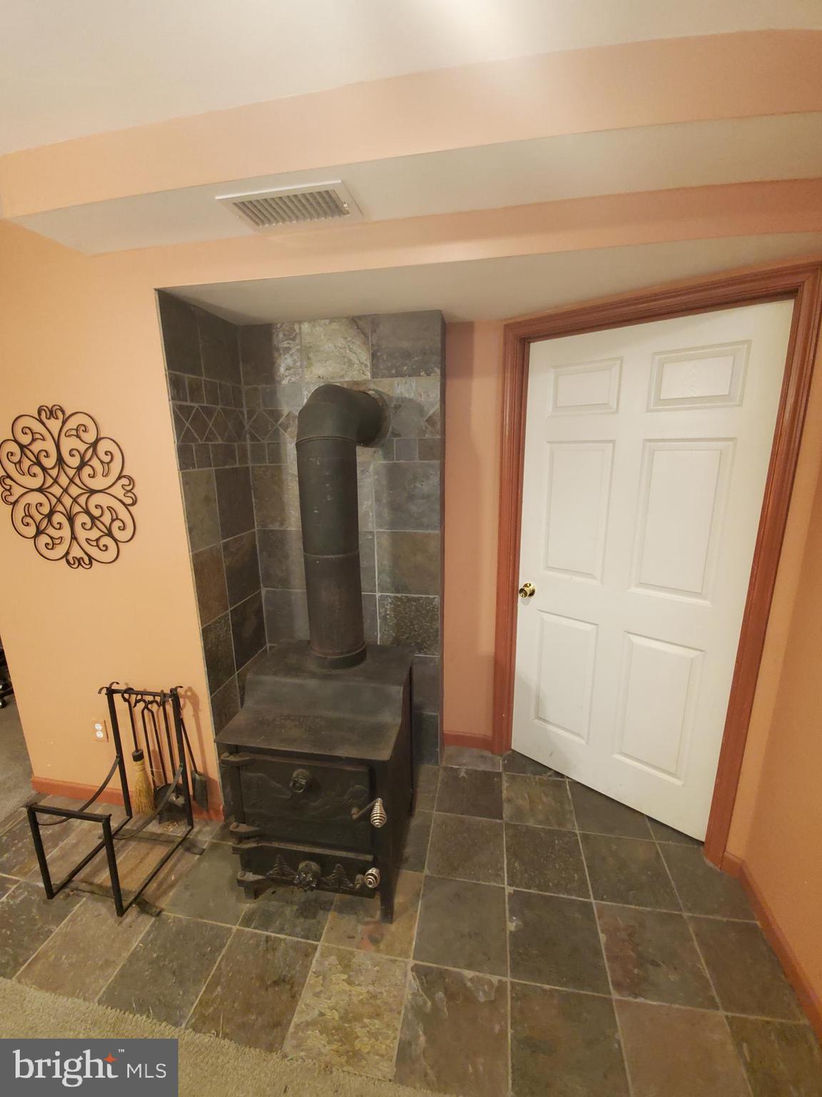 4515 Chestnut Ridge Drive Manchester, MD 21102 - Photo 37 of 47 Basement wood burning stove