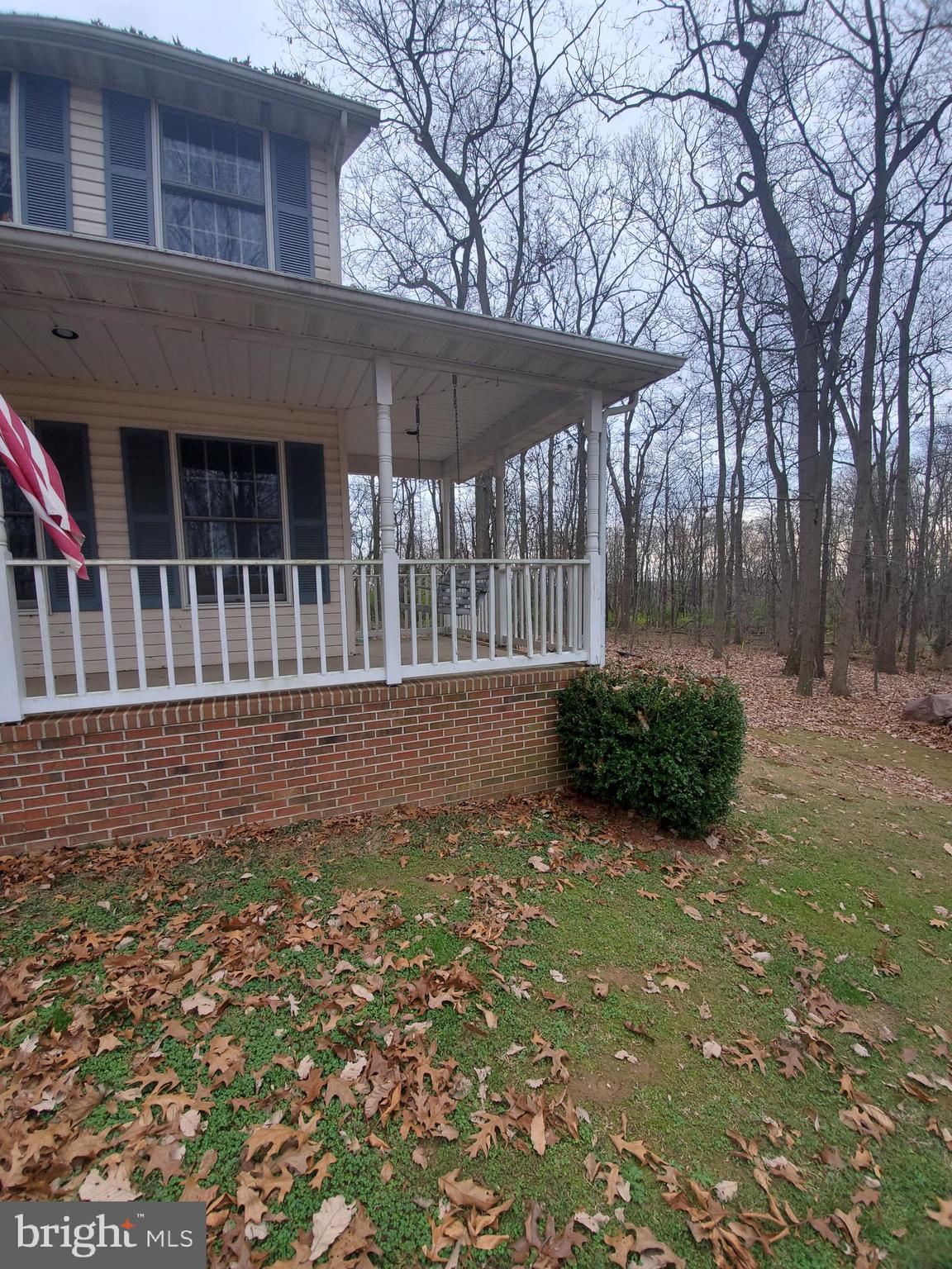 4515 Chestnut Ridge Drive Manchester, MD 21102 - Photo 5 of 47 L-shaped covered porch features a swing