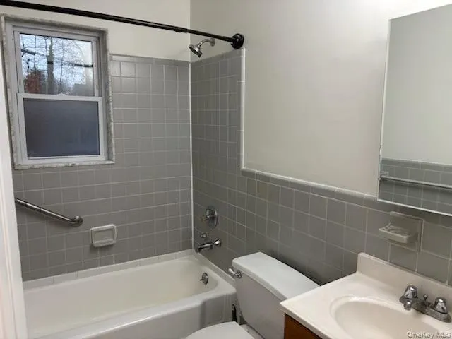 a bathroom with a sink and shower