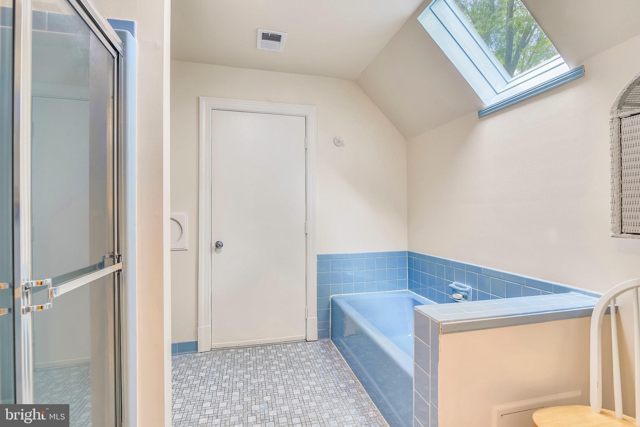 10810 Hunter Station Road Vienna, VA 22181 - Photo 40 of 68 Master bath with a skylight and door to attic.