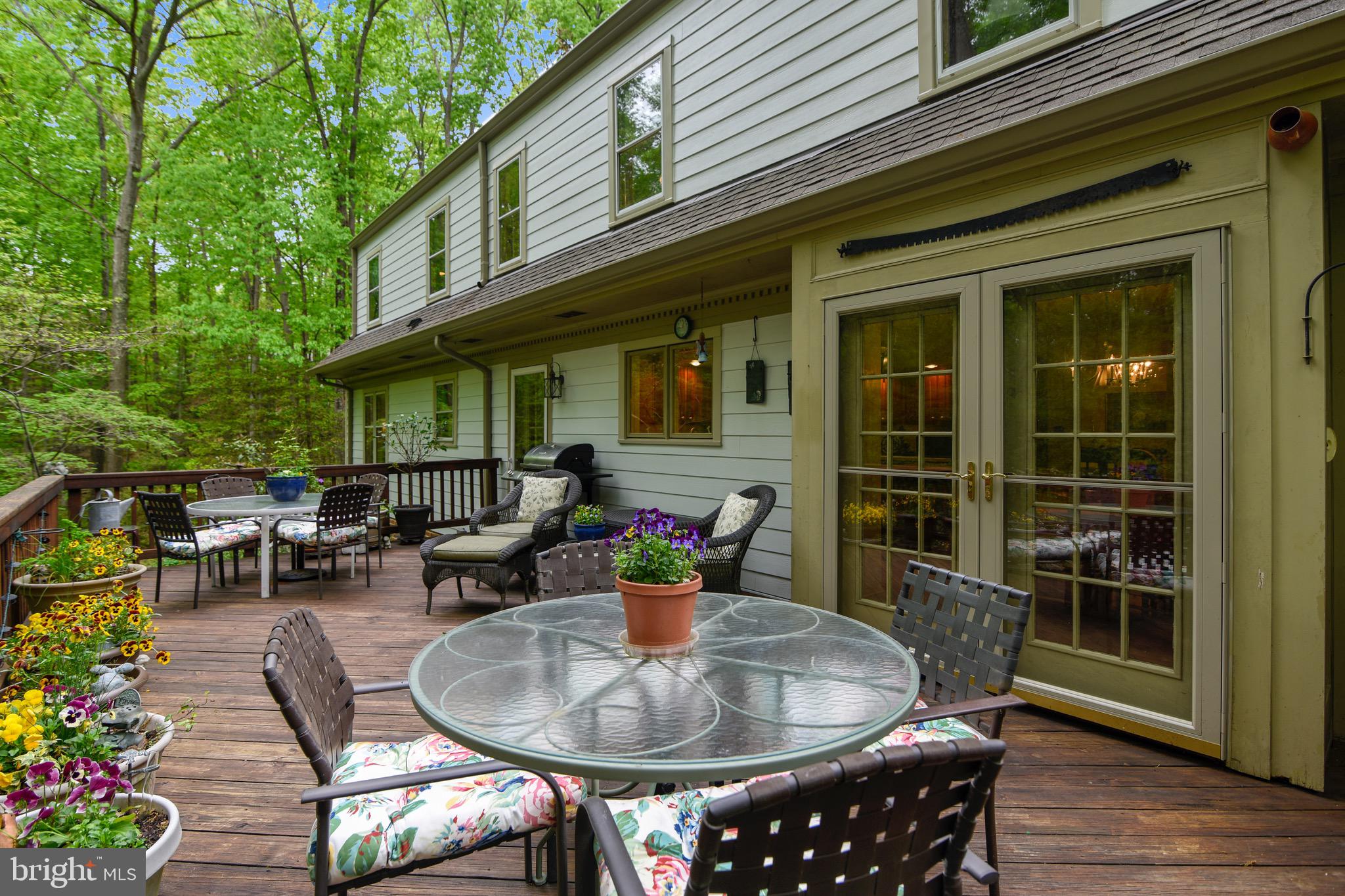 The deck is convently located  near the kitchen.