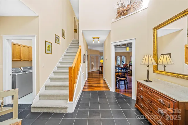 a kitchen with stainless steel appliances granite countertop a sink and a stove