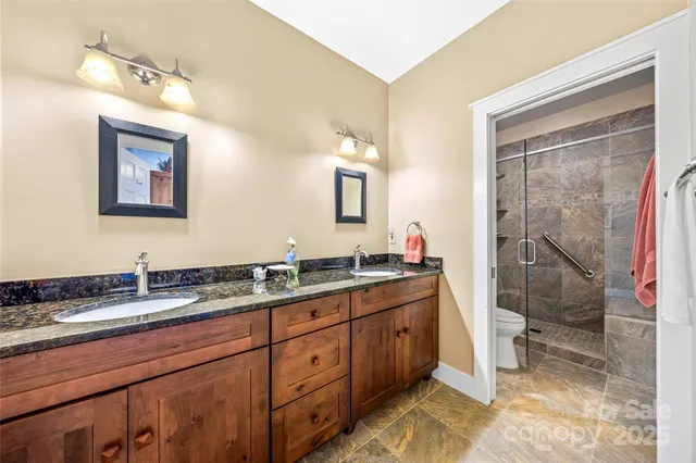 a bathroom with a shower and a toilet