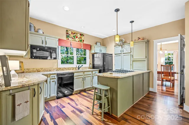 a kitchen with a sink stove and wooden cabinets