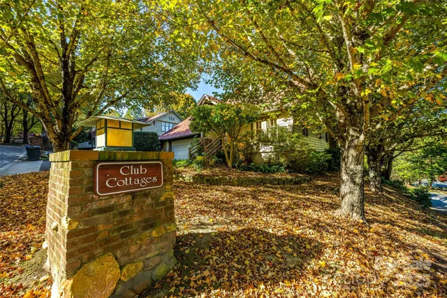 a backyard of a house with outdoor seating