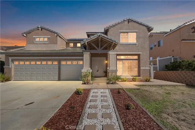 a front view of a house with yard
