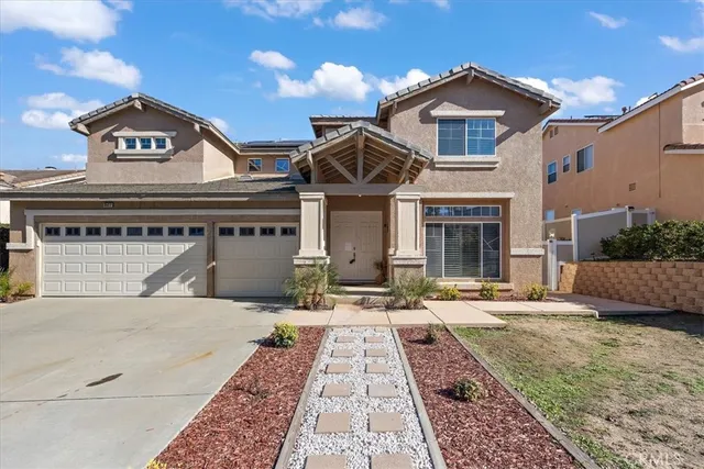 a front view of a house with yard