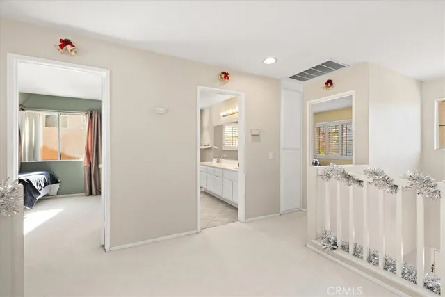 a bedroom with a large bed and a couch