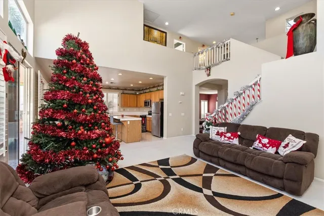 a living room with furniture and flowers