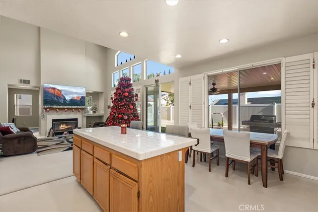 a kitchen with a sink and chairs