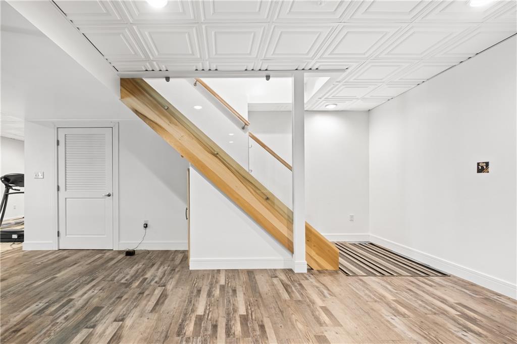 478 Spruce Lane Houston, PA 15342 - Photo 35 of 45 Steps leading to the LL game room w/luxury vinyl flooring