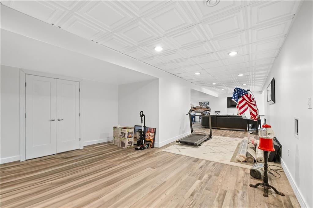 478 Spruce Lane Houston, PA 15342 - Photo 42 of 45 Large finished area, could add wall for additional bedroom* Laundry hookups behind the doors