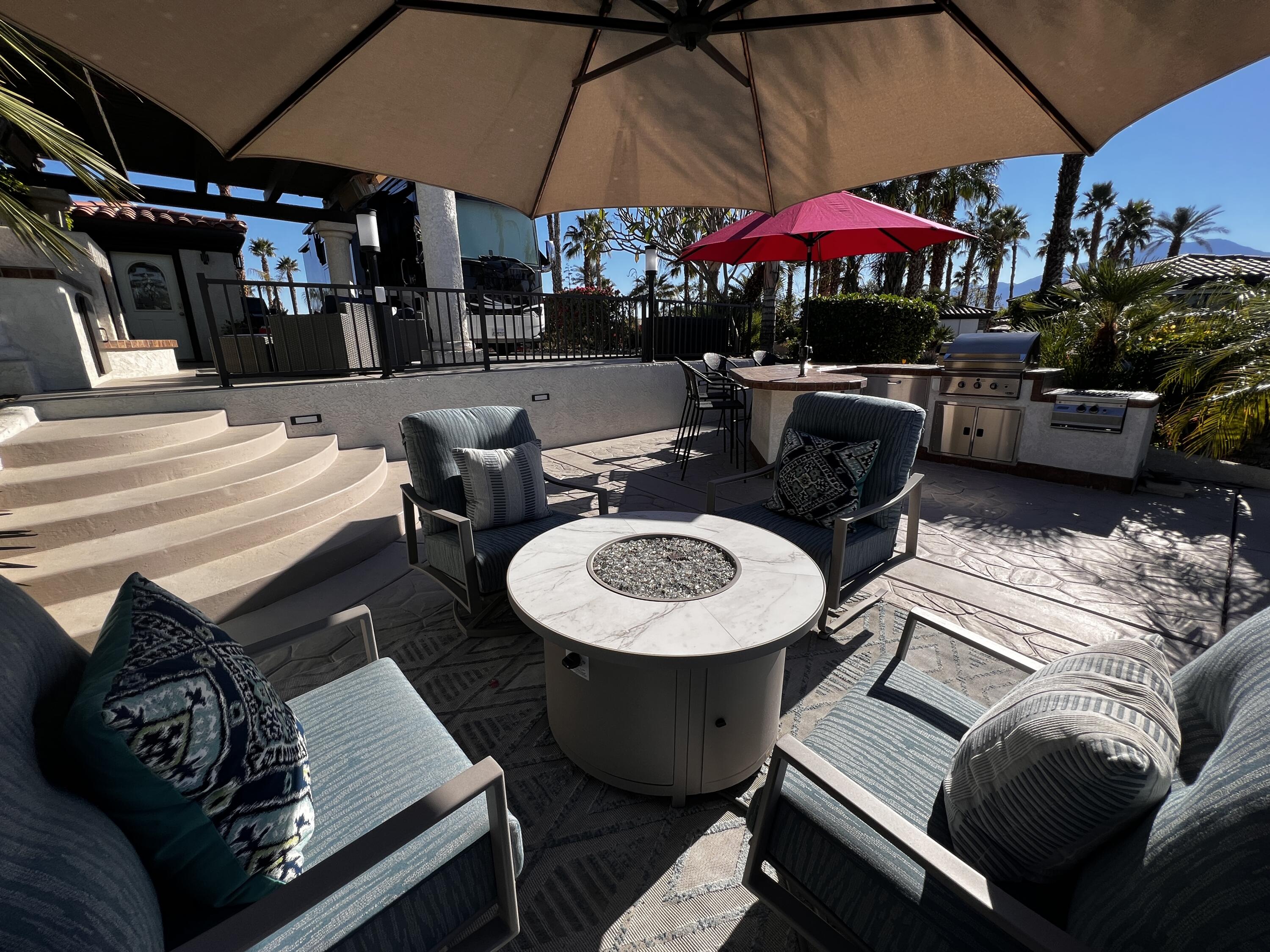 80501 Ave 48, Unit 110 Indio, CA 92201 - Photo 13 of 35 a outdoor space with patio the tables and chairs