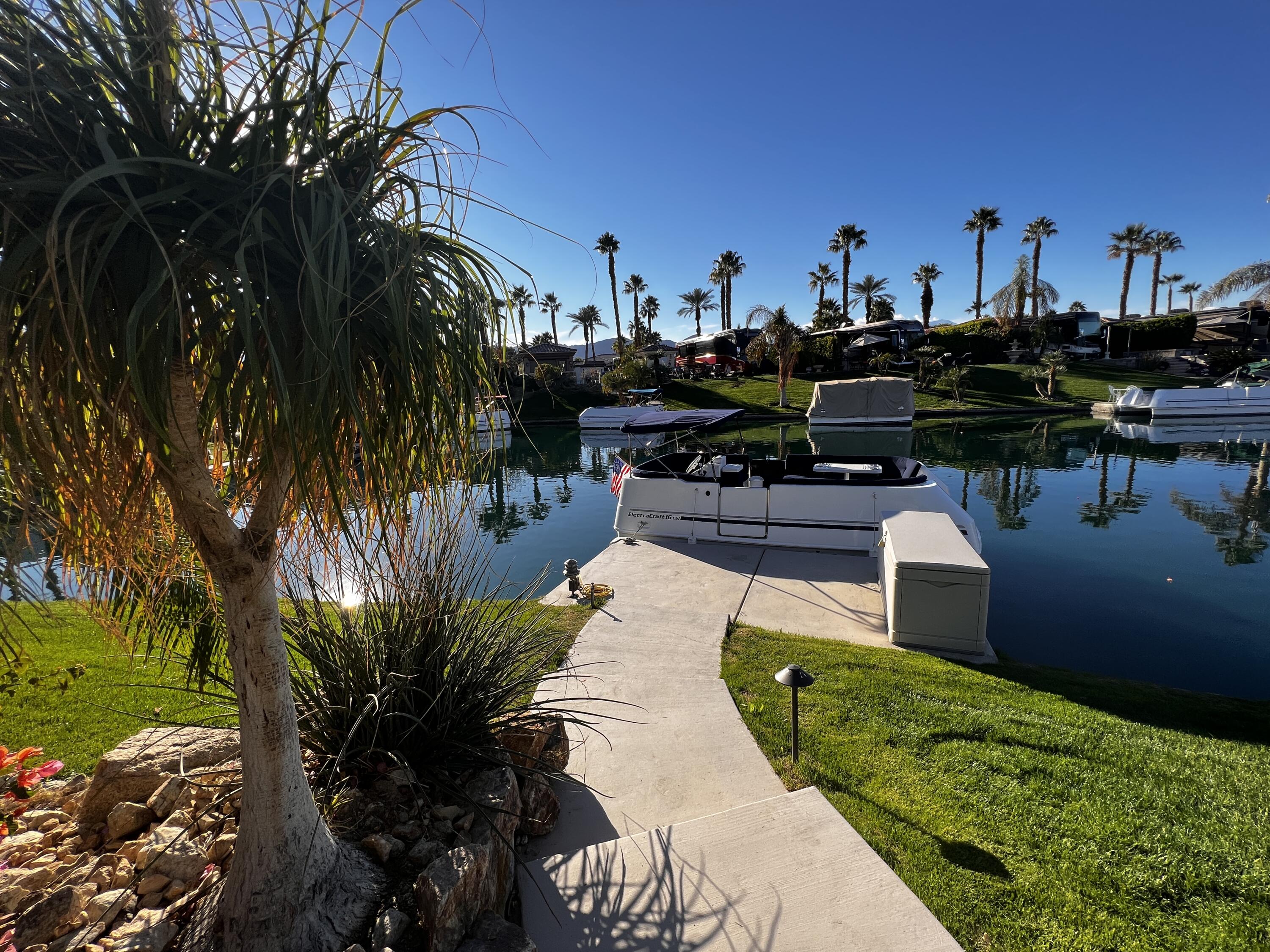 80501 Ave 48, Unit 110 Indio, CA 92201 - Photo 21 of 35 a view of a lake with a building in the background