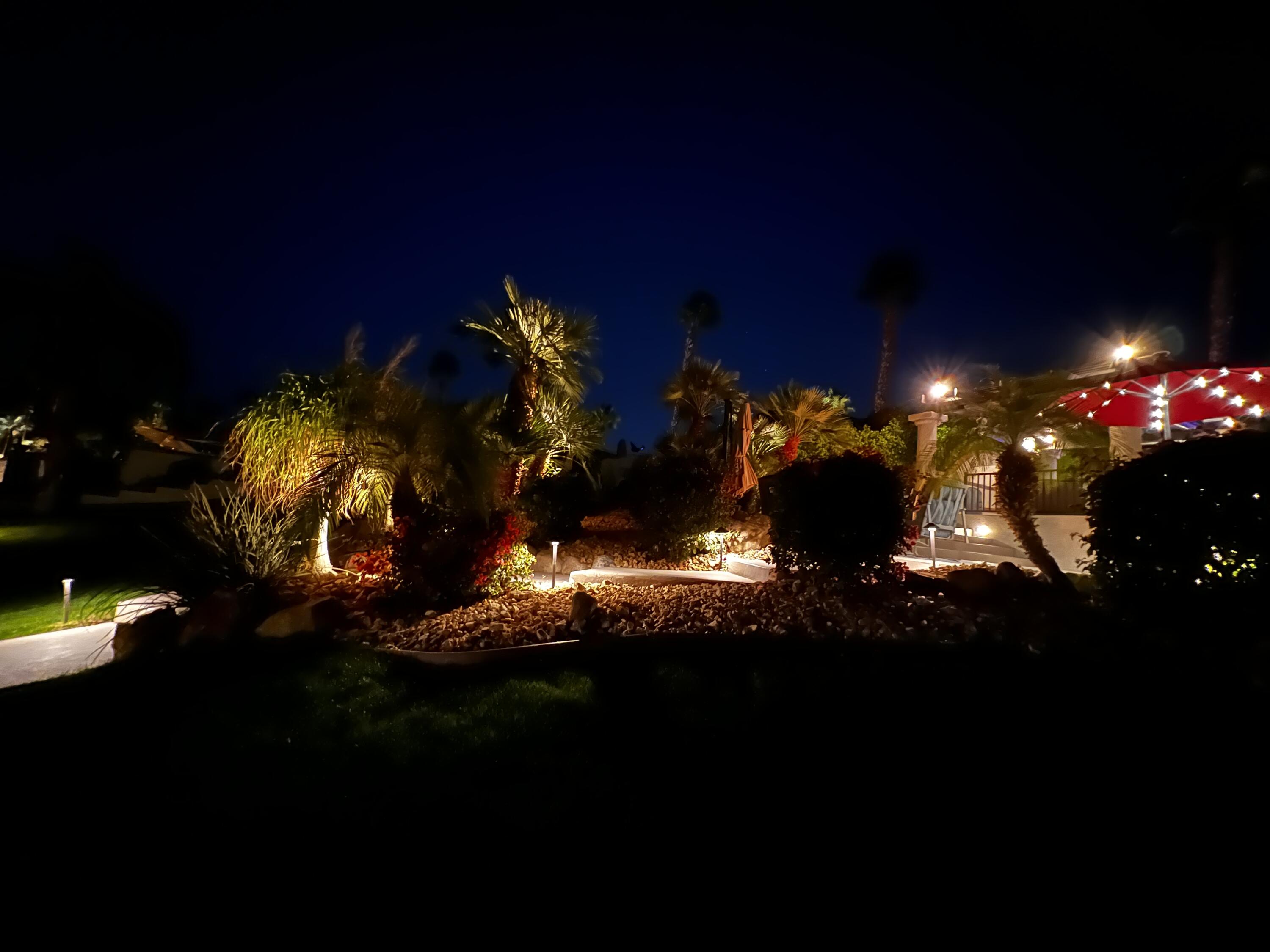 80501 Ave 48, Unit 110 Indio, CA 92201 - Photo 24 of 35 a view of a swimming pool with an outdoor seating and a fire pit